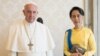 FILE - State Counsellor and Union Minister for Foreign Affairs of the Republic of the Union of Myanmar Aung San Suu Kyi, right, poses with Pope Francis on the occasion of their private audience, at the Vatican, May 4, 2017. 