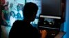 A visitor looks at the online Nelson Mandela Digital Archive on a computer screen in Johannesburg on Mar. 27, 2012.