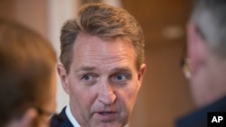 Sen. Jeff Flake, R-Ariz., who announced last year he would not run for re-election in 2018, takes questions from reporters at the Capitol in Washington, Jan. 4, 2018.