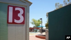 FILE - This June 28, 2018, file photo shows buildings that house juveniles and operations on the grounds of Southwest Key Campbell, a shelter for children that had been separated from their parents in Phoenix. Arizona.
