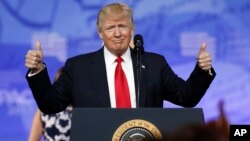 President Donald Trump gives thumbs up as he arrives to speak at the Conservative Political Action Conference, Feb. 24, 2017, in Oxon Hill, Maryland.