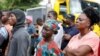 People watch rescue operations after an under-construction building collapsed in Oniru, Lagos