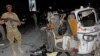 FILE - A Somali soldier stands guard near a destroyed auto rickshaw after a car bomb was detonated in Mogadishu, Somalia, Aug 4, 2017. At least three people were killed in the blast. On Aug. 10, another car bomb blast injured three people in the city.