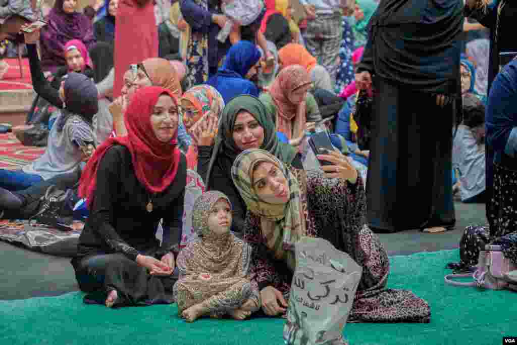 After finishing the prayers, friends, and relatives pose for selfies together in the ancient mosque of Sultan Hassan in Old Cairo. (H. Elrasam/VOA)
