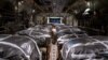 In this image obtained from the U.S. Department of Defense, humanitarian aid pallets rigged with parachutes for an airdrop over Gaza aboard a C-130J Super Hercules are loaded and prepared for takeoff at an undisclosed location in Southwest Asia, March 1, 2024.