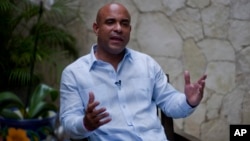 Former Haitian Prime Minister Laurent Lamothe speaks during an interview with Associated Press in Port-au-Prince, Dec. 15, 2014. 