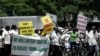 FILE - Supporters of the Zimbabwe African National Union's Patriotic Front (ZANU-PF) march in Harare, Feb. 24, 2010, to protest against a European Union decision to extend economic sanctions on Zimbabwe.