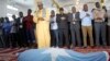 Religious leaders and journalists attend prayers before a funeral for Abdiaziz Mohamud Guled who worked with the government-owned Radio Mogadishu and was killed in a suicide attack, in Mogadishu, Nov. 21, 2021.
