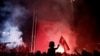 A young boy waves a Turkish national flag as supporters of Turkish President Tayyip Erdogan gather during a pro-government demonstration on Taksim square in Istanbul, Turkey, July 18, 2016. 