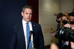 FILE - Congressman Adam Kinzinger, a Republican from Illinois, speaks to reporters at the Capitol in Washington, May 12, 2021.