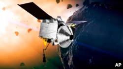 This illustration provided by NASA depicts the OSIRIS-REx spacecraft at the asteroid Bennu. The rocky remnant from the dawn of the solar system may hold clues to the origins of life.