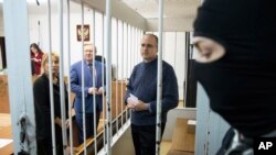 FILE - Paul Whelan, a former U.S. Marine, who was arrested for alleged spying in Moscow at the end of 2018, waits for a hearing in a court in Moscow, Russia, May 24, 2019. 