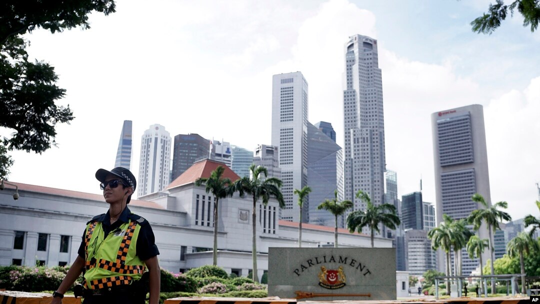 Police patrol the area surrounding Singapore's Parliament House, Jan. 15, 2016.