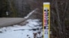 FILE - A signpost sits near Enbridge’s Mackinaw facility, servicing the company’s existing underwater Line 5 pipeline and its planned replacement tunnel under Lake Michigan, in Mackinaw City, Michigan, Feb. 25, 2024.