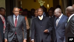 Self-proclaimed transitional president Michel Djotodia, right, met with Kenya's President Uhuru Kenyatta, left, Uganda's President Yoweri Museveni, center, to discuss the crisis at UN offices in Nairobi, July 31, 2013.