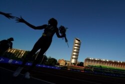 FILE - Sha'Carri Richardson greets fans after winning the women's 100-meter run at the US Olympic Track and Field Trials on June 19, 2021, in Eugene, Ore.