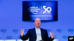 Klaus Schwab, founder and Executive Chairman of the World Economic Forum poses for a photo after an interview with the Associated Press in Davos, Switzerland, Jan. 19, 2020.