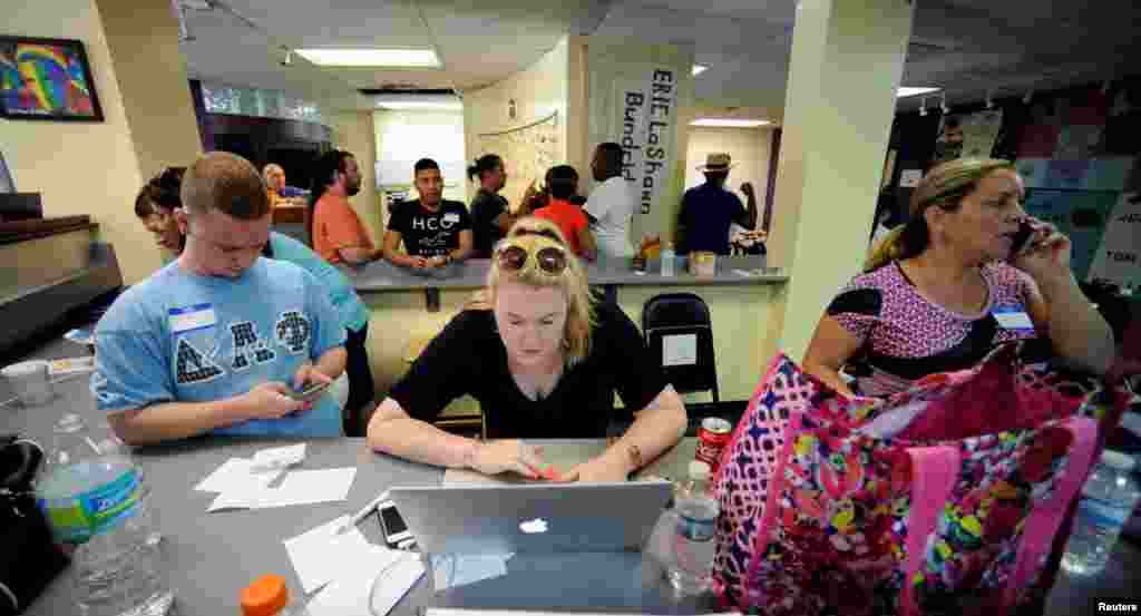 Volunteers Clinton Grubb Brittani Acuff and others gather at The Center, a LGBT organization, to provide assistance and counseling to the community after an early morning shooting at a gay nightclub in Orlando, Florida, June 12, 2016.