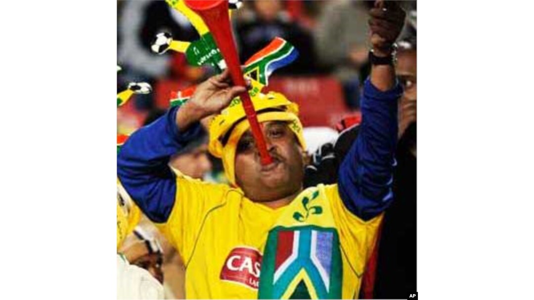 South African fans show their enthusiasm by blaring vuvuzela trumpets