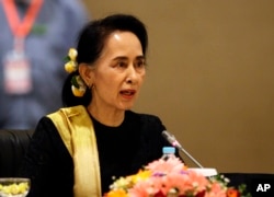 FILE - Myanmar's State Counsellor Aung San Suu Kyi speaks to members of the Union Peace Dialogue Joint Committee (UPDJC) on its ninth meeting at a hotel in Naypyitaw, Myanmar, Feb. 6. 2017. Suu Kyi and her administration made a peace process to end almost