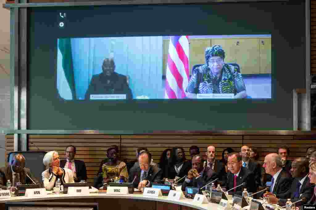 Sierra Leone's President Ernest Bai Koroma (top left) and Liberia's President Ellen Johnson Sirleaf appear via video conference at a meeting to address the Ebola crisis, during the IMF-World Bank annual meetings in Washington, Oct. 9, 2014.