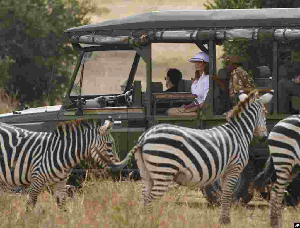 First lady Melania Trump observes zebras during a safari at Nairobi National Park in Nairobi, Kenya, Oct. 5, 2018.