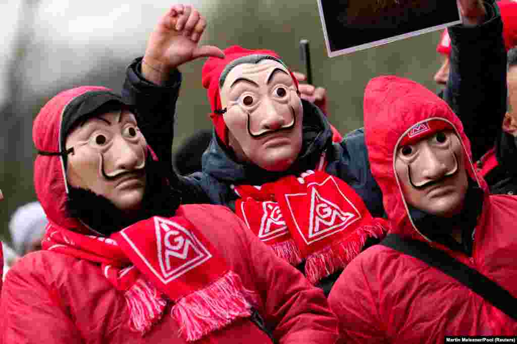 VW employees attend a rally of the union IG Metall in front of the Volkswagen headquarters, during a warning strike at the main factory of Germany's carmaker in Wolfsburg.