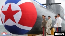 朝鲜官媒2023年9月8日发布照片显示，朝鲜领导人金正恩出席战略核攻击潜艇下水仪式。