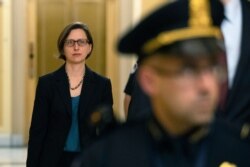 FILE - Deputy Assistant Secretary of Defense Laura Cooper arrives for a closed-door meeting on Capitol Hill in Washington, Oct. 23, 2019.