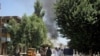 Asap mengepul dari sebuah gedung setelah serangan maut termasuk dugaan bom mobil bunuh diri dan baku tembak, di Jalalabad, Afghanistan, Selasa, 31 Juli 2018., sebagai ilustrasi.(Foto: AP)