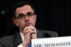 Tim Morrison, a former official at the National Security Council, listens as he testifies before the House Intelligence Committee on Capitol Hill in Washington, Nov. 19, 2019, during an impeachment hearing.