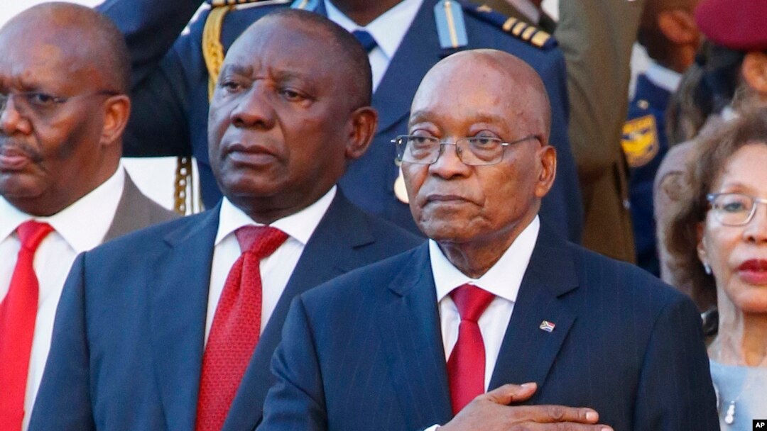 FILE - South African President Jacob Zuma, right, alongside deputy president Cyril Ramaphosa, left, outside parliament at the State of the Nation address in Cape Town, South Africa, Feb. 9, 2017.