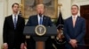 President Donald Trump, flanked by Sen. Tom Cotton, R- Ark., left, and Sen. David Perdue, R-Ga., speaks in the Roosevelt Room of the White House in Washington, Aug. 2, 2017, spotlighting legislation that would place new limits on legal immigration. 