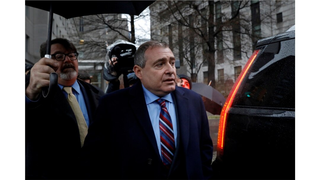 FILE - Lev Parnas, an associate of President Donald Trump's personal lawyer, Rudy Giuliani, exits after a bail hearing at U.S. District Court in New York, Dec. 17, 2019.