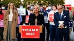 FILE - Former Florida Attorney General Pam Bondi speaks during a news conference on legal challenges to vote counting in Pennsylvania, Nov. 4, 2020, in Philadelphia. At left is Lara Trump, daughter-in-law of President Trump, and at right is Rudy Giuliani.