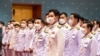 This handout taken and released by Thai Parliament on July 3, 2023 shows Move Forward Party’s leader and prime ministerial candidate Pita Limjaroenrat (C) lining up with fellow MPs before the arrival of Thai King Maha Vajiralongkorn during the official ce