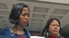 United Filipinos in Hong Kong chairperson Dolores Balladares, Asian Migrants' Coordinating Body spokesperson Eni Lestari and Association of Indonesian Migrant Workers' representative Ganika Diristiani (from L-R), pose with the court verdict outside the Hi
