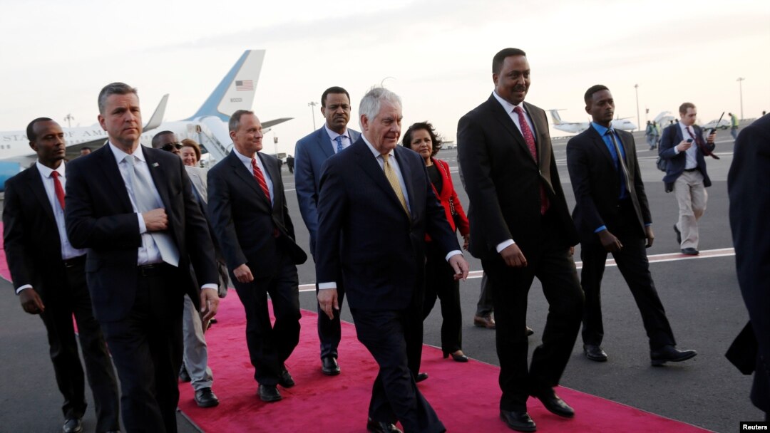Ethiopia's Minister of Foreign Affairs Workneh Gebeyehu (center R) walks the red carpet with U.S. Secretary of State Rex Tillerson as he arrives to begin a six-day trip in Africa, landing at Addis Ababa International Airport in Addis Ababa, March 7, 2018.