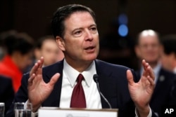 FILE - Former FBI Director James Comey testifies during a Senate Intelligence Committee hearing on Capitol Hill, June 8, 2017, in Washington.