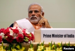 FILE - India's Prime Minister Narendra Modi attends an event organized by the Christian community to celebrate the beatification of two Indians by Pope Francis late last year, in New Delhi, Feb. 17, 2015.