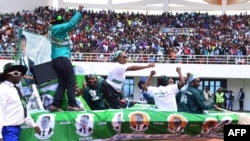 Supporters of incumbent Zambian President Edgar Lungu cheer on May 21, 2016, at the Heroes Stadium in Lusaka during the launch of his re-election campaign ahead of polling day on August 11.
