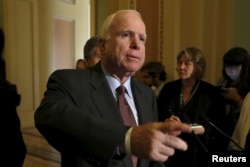 FILE - Sen. John McCain talks to the media on Capitol in Washington June 18, 2015.
