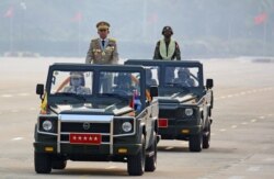 Myanmar's junta chief Senior General Min Aung Hlaing, who ousted the elected government in a coup on February 1, presides an army parade on Armed Forces Day in Naypyitaw, Myanmar, March 27, 2021.