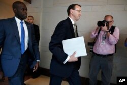 Deputy Attorney General Rod Rosenstein arrives on Capitol Hill in Washington, May 18, 2017, for a closed-door meeting with Senators.