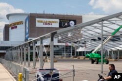 Temporary structures go up outside the Wells Fargo Center ahead of the 2016 Democratic National Convention in Philadelphia, June 20, 2016.