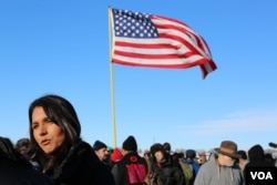 U.S. Representative Tulsi Gabbard of Hawaii speaks to reporters after addressing veterans near the Standing Rock camp in North Dakota (E. Sarai/VOA)