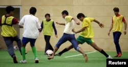 Asylum seekers take part in a soccer training session in Vienna, Austria, September 25, 2015. Austrian top league soccer club FK Austria Wien provides facilities and professional coaches to migrants for recreation and talent seeking.