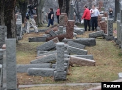 Local and national media report on more than 170 toppled Jewish headstones after a weekend vandalism attack on Chesed Shel Emeth Cemetery in University City, a suburb of St Louis, Missouri, Feb. 21, 2017.