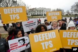 FILE - CASA de Maryland, an immigration advocacy and assistance organization, holds a rally in Lafayette Park, across from the White House in Washington, Jan. 8, 2018.