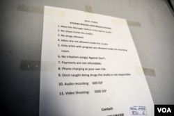 A sign at a recording studio in Juba warns against songs critical of South Sudan's government, June 4 2016. (J. Patinkin/VOA)